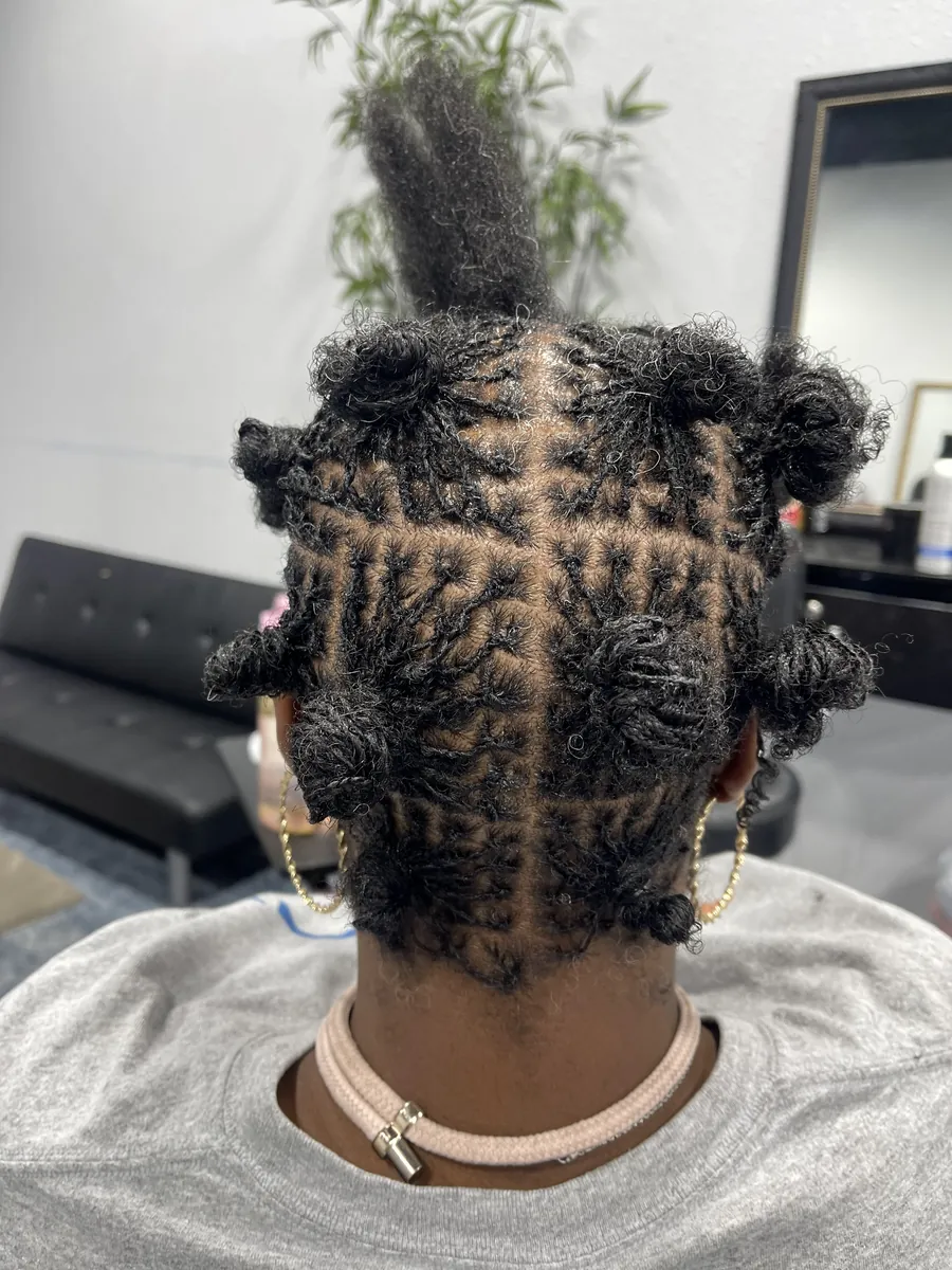 Child's style with bantu knots and a braided top