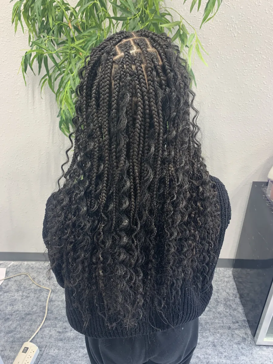 Long black boho knotless braids with curly pieces