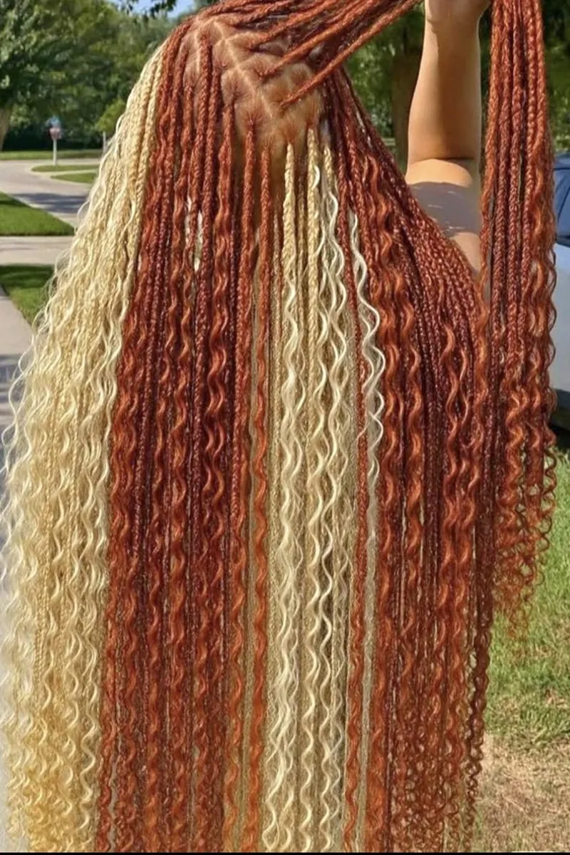 Waist-length boho knotless braids in ginger and blonde with curly pieces