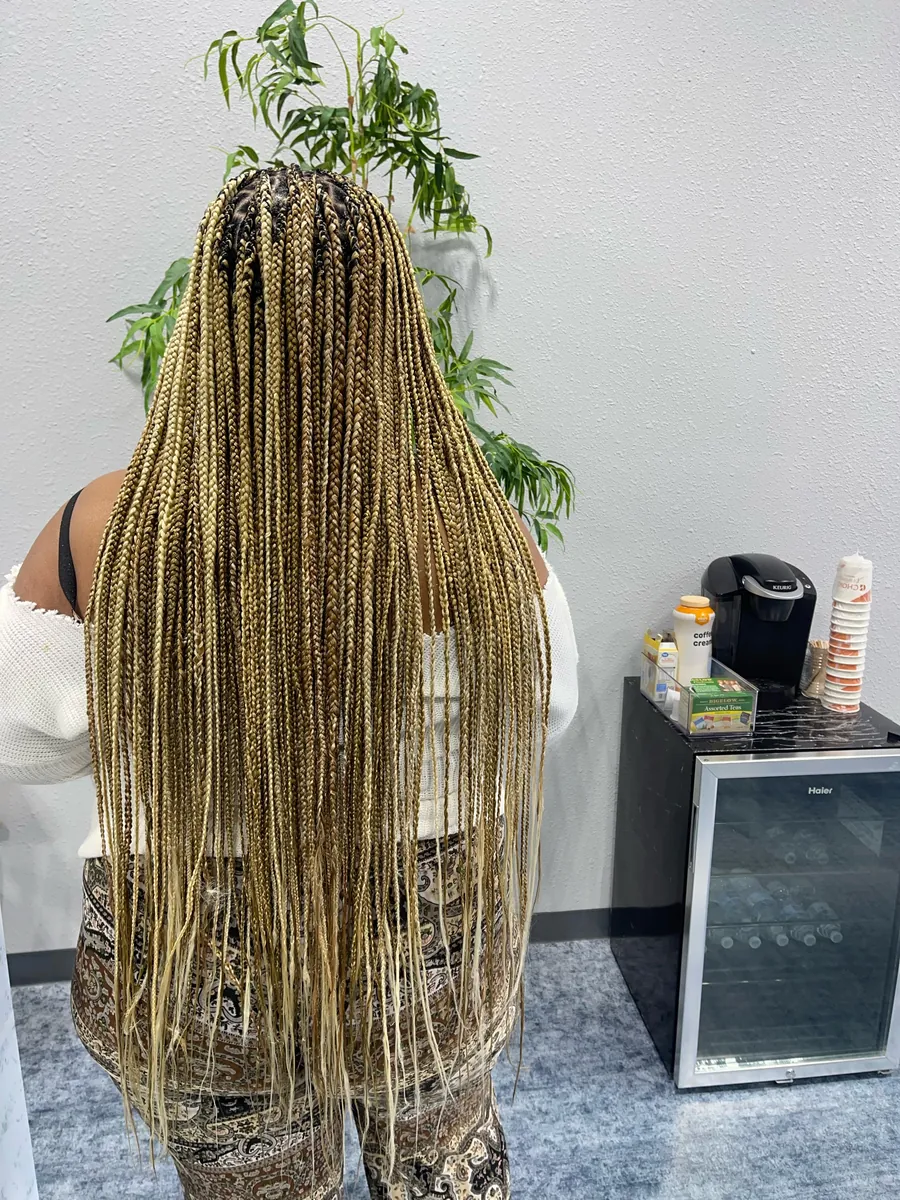 Long honey-blonde knotless braids