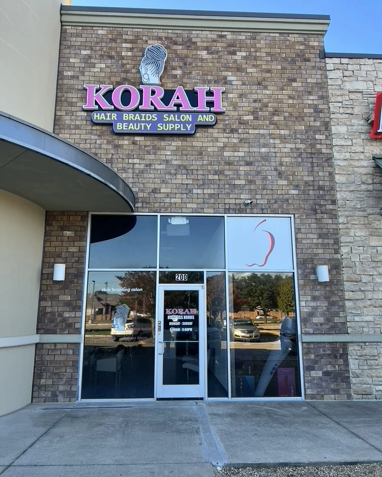 The Korah storefront at 5000 Western Center Blvd, Suite 200, with the pink KORAH sign over the glass front
